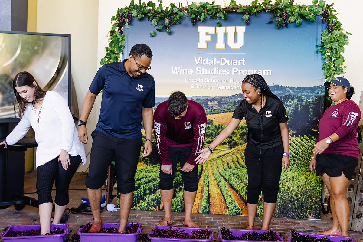 Attendees stomping on grapes